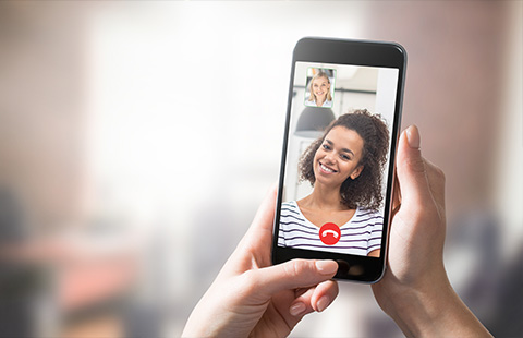 woman holding smartphone with video call smiling bright screen connection 10 tips for video calls